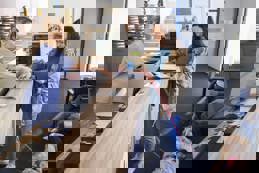 Woman with dog at vet reception