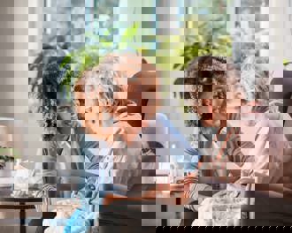 Nurse supporting eldery lady