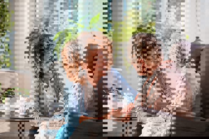 Nurse supporting eldery lady