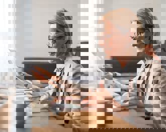 Businesswoman reviewing documents 