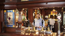 Pub landlord preparing paperwork