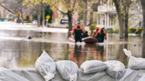 Flood Protection Sandbags with flooded homes